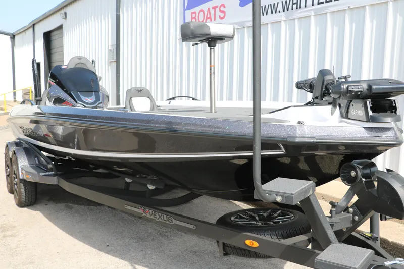 Slide: The Image of 2025 Vexus VXS 21 boat on trailer, sleek design, parked outside a building. - 4