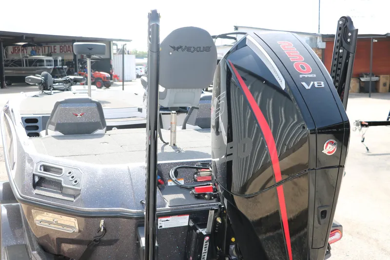 Slide: The Image of 2025 Vexus VXS 21 boat with powerful V8 engine, showcased at a dealership. - 6