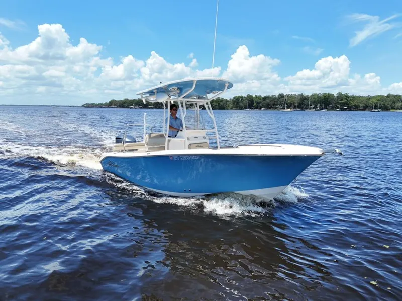 Slide: The Image of 2021 Carolina Skiff Sea Chaser 22 HFC boat cruising on a sunny day. - 1