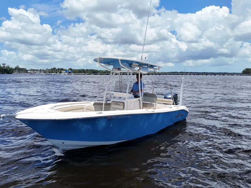 Slide: The Image of 2021 Carolina Skiff Sea Chaser 22 HFC boat on a sunny day, open water, blue sky. - 15