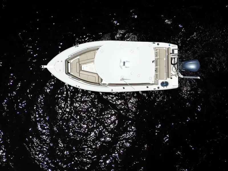 Slide: The Image of Aerial view of 2021 Carolina Skiff Sea Chaser 22 HFC boat on dark water. - 17