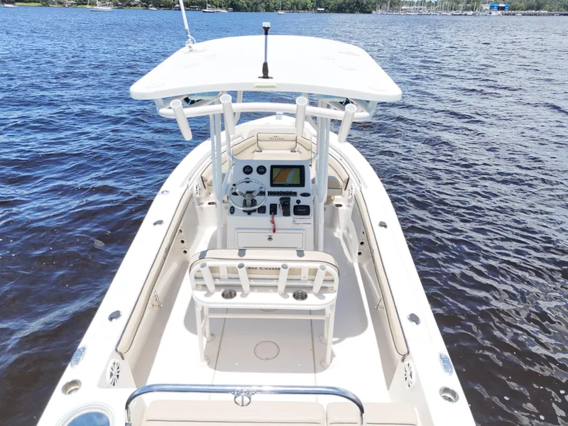 Slide: The Image of 2021 Carolina Skiff Sea Chaser 22 HFC boat on water, featuring center console and T-top. - 20