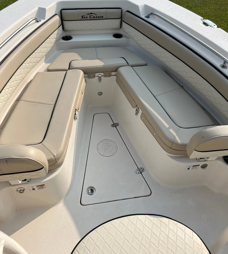 Slide: The Image of 2021 Carolina Skiff Sea Chaser 22 HFC boat interior with cushioned seating. - 25