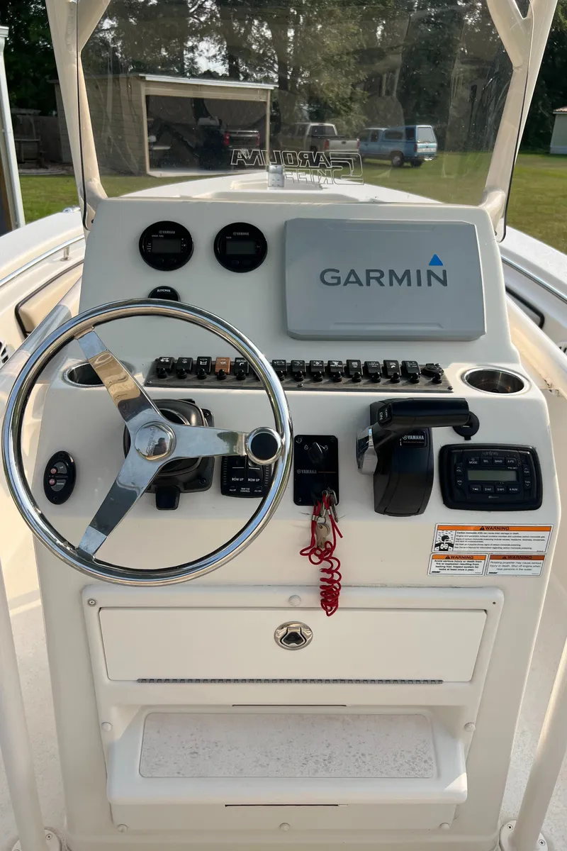 Slide: The Image of 2021 Carolina Skiff Sea Chaser 22 HFC dashboard with Garmin navigation system. - 27