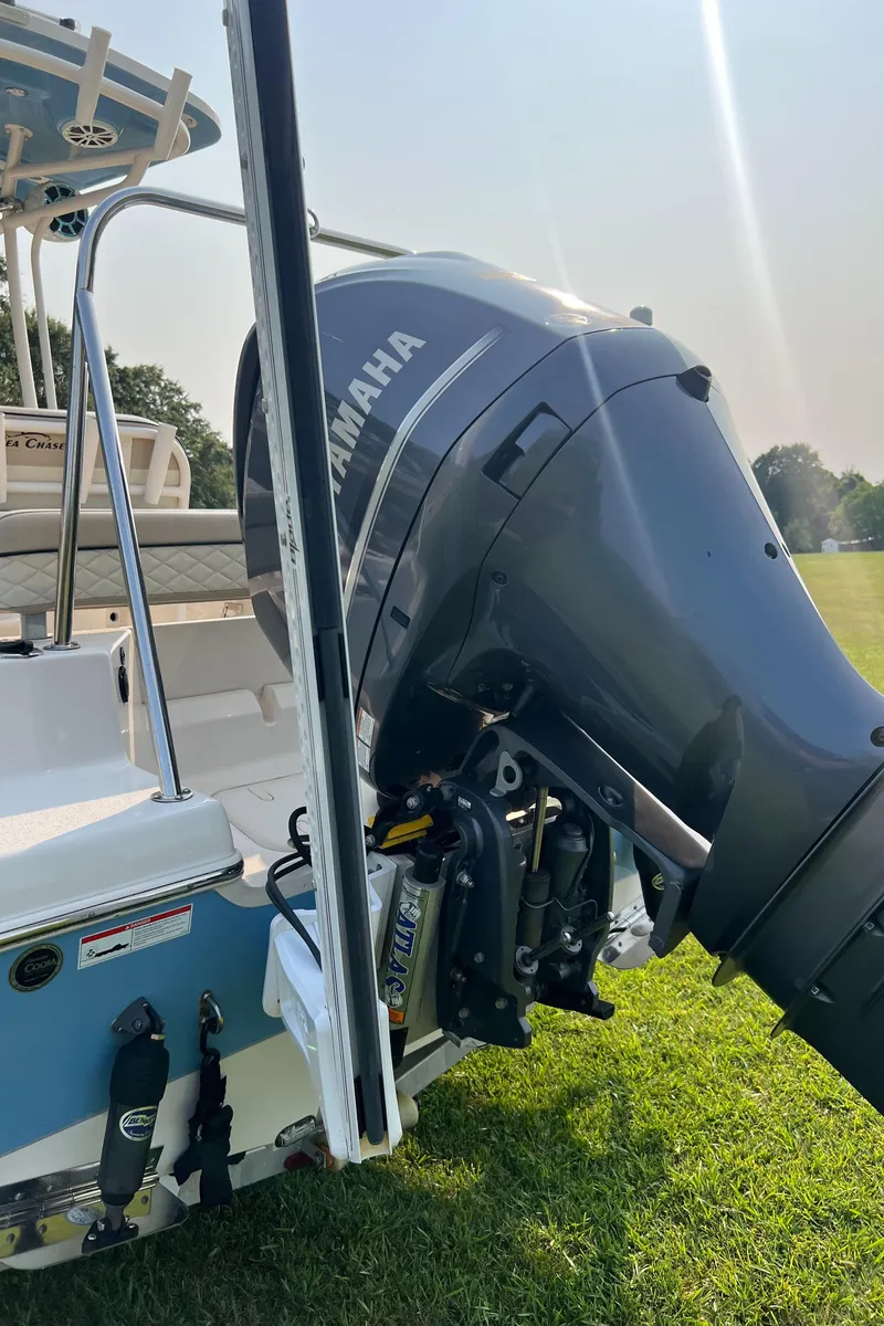 Slide: The Image of 2021 Carolina Skiff Sea Chaser 22 HFC with Yamaha outboard motor on grassy field. - 30