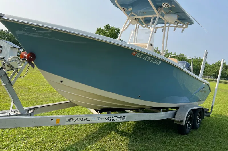 Slide: The Image of 2021 Carolina Skiff Sea Chaser 22 HFC on trailer, parked on grass. - 31
