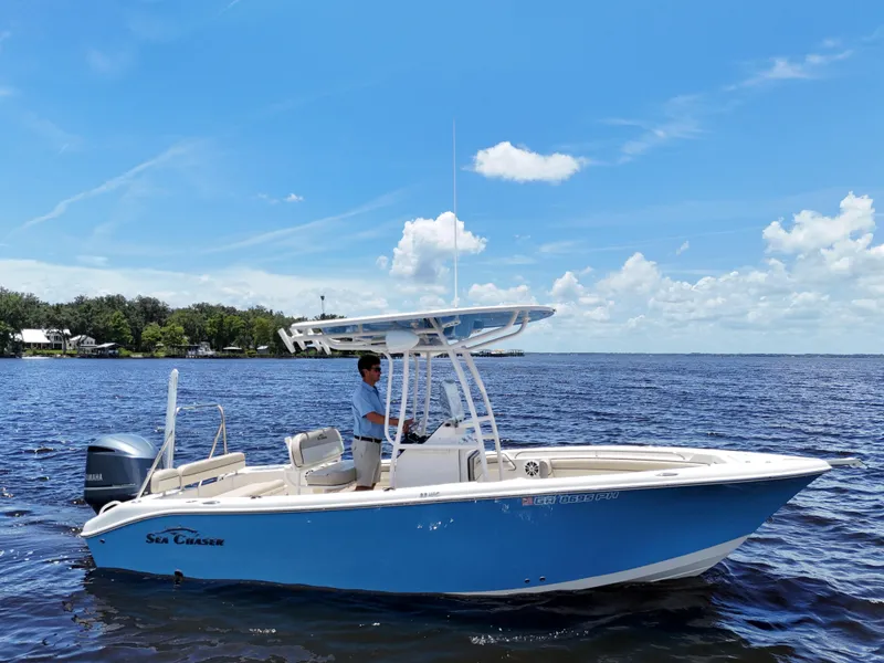 Slide: The Image of 2021 Carolina Skiff Sea Chaser 22 HFC boat on a sunny lake. - 8