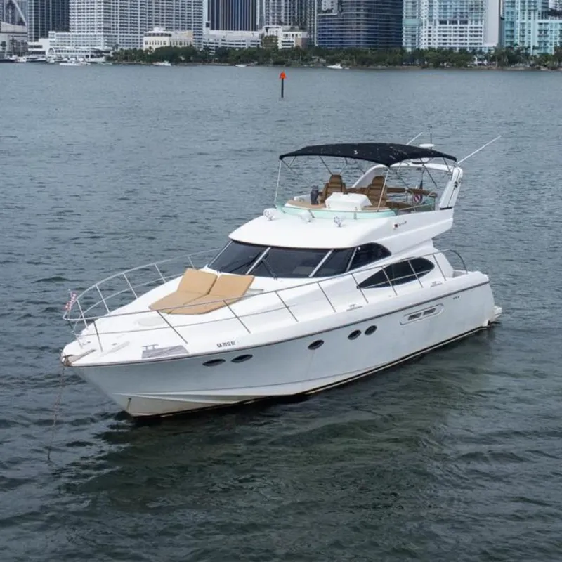The Image of Luxury 2002 Dyna 50 yacht cruising near city skyline. - 0