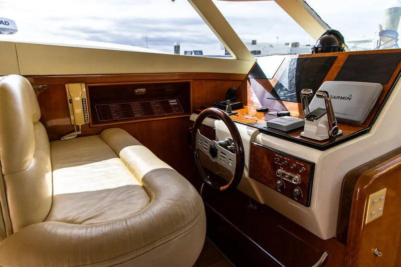 Slide: The Image of Luxurious 2002 Dyna 50 yacht interior with leather seating and advanced navigation equipment. - 10