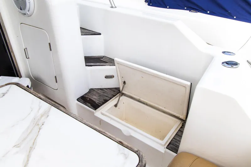 Slide: The Image of Interior of 2002 Dyna 50 yacht with open storage compartment and steps. - 14