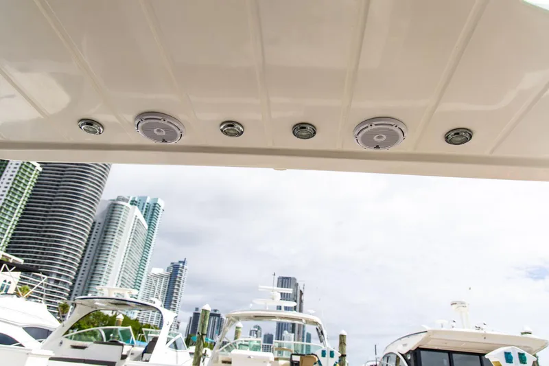 Slide: The Image of Rooftop view of a 2002 Dyna 50 yacht with city skyline in the background. - 16