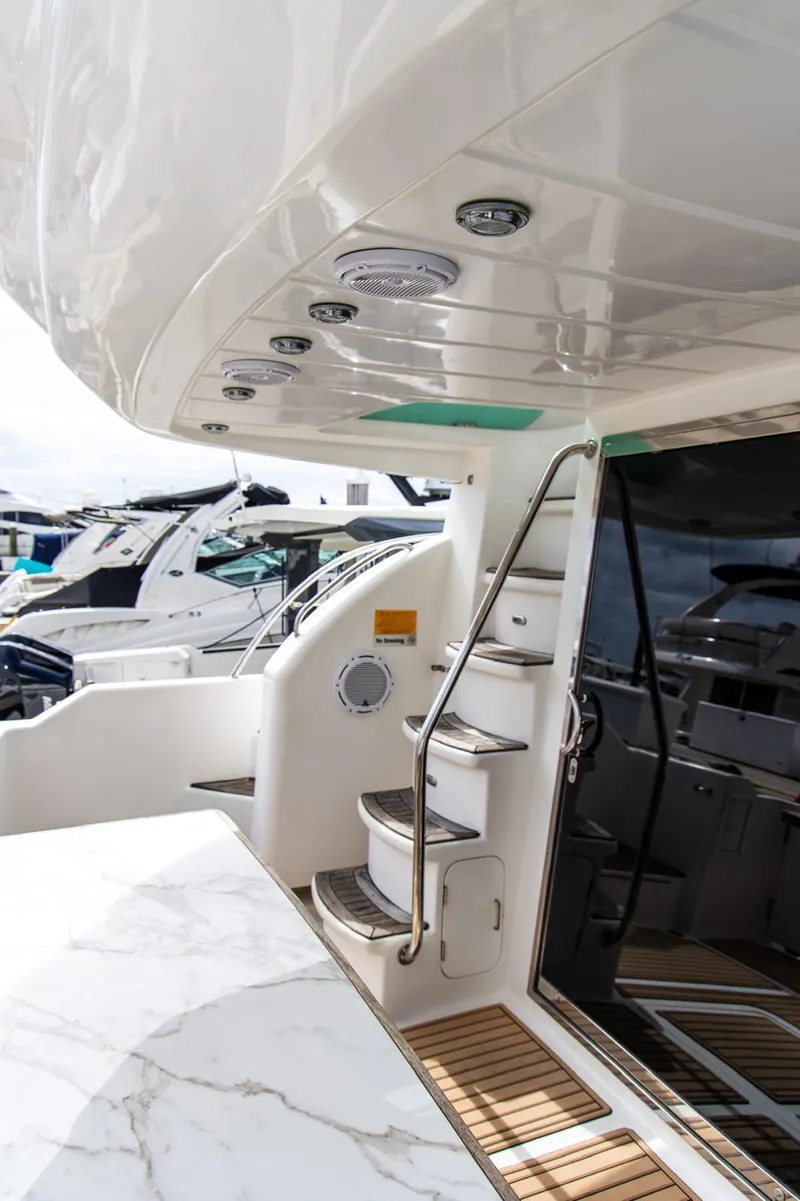 Slide: The Image of Luxury yacht interior with sleek design, featuring a staircase and polished surfaces, Dyna 50, 2002 model. - 17