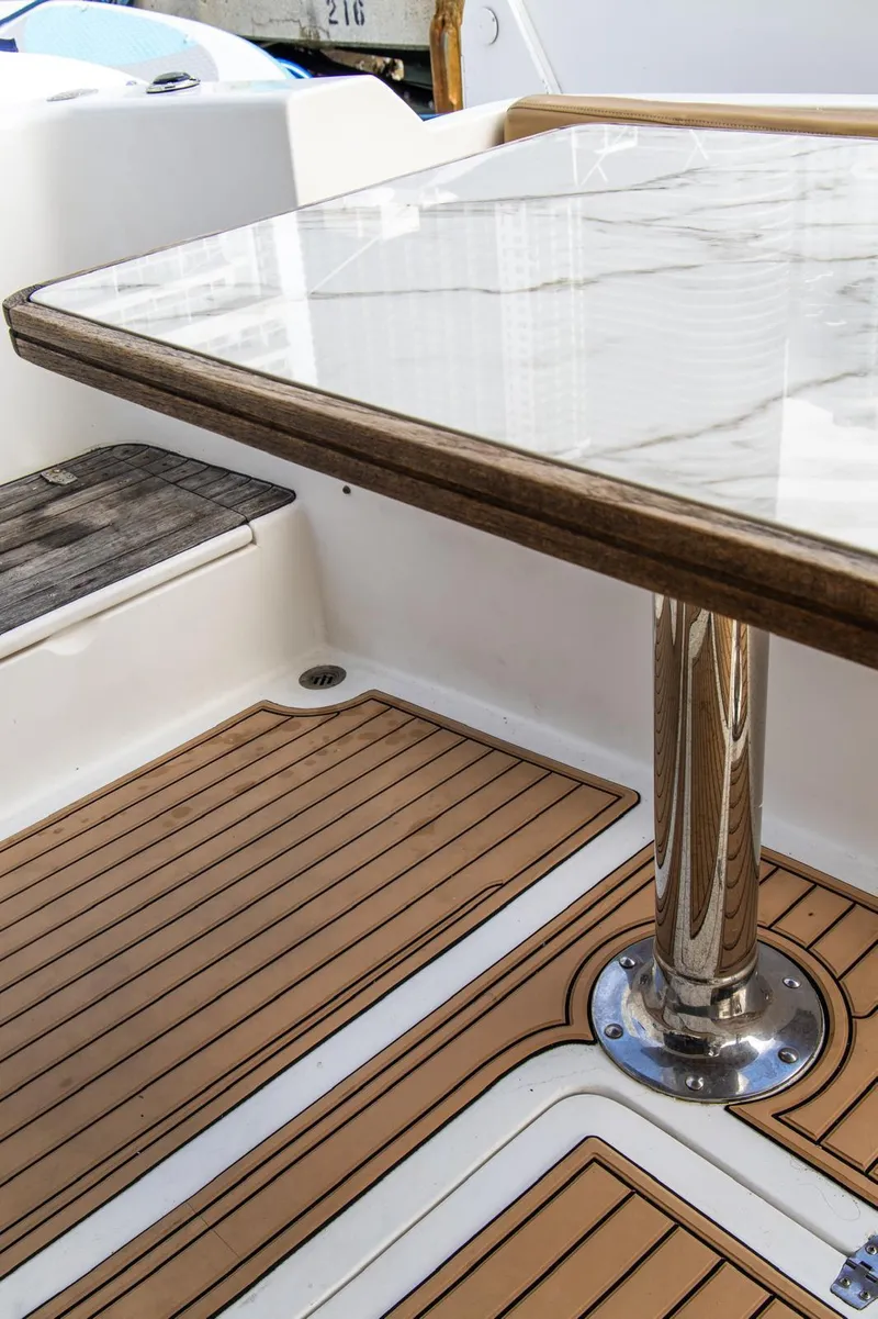 Slide: The Image of Luxury yacht deck with wooden flooring and a marble table, Dyna 50, 2002 model. - 21