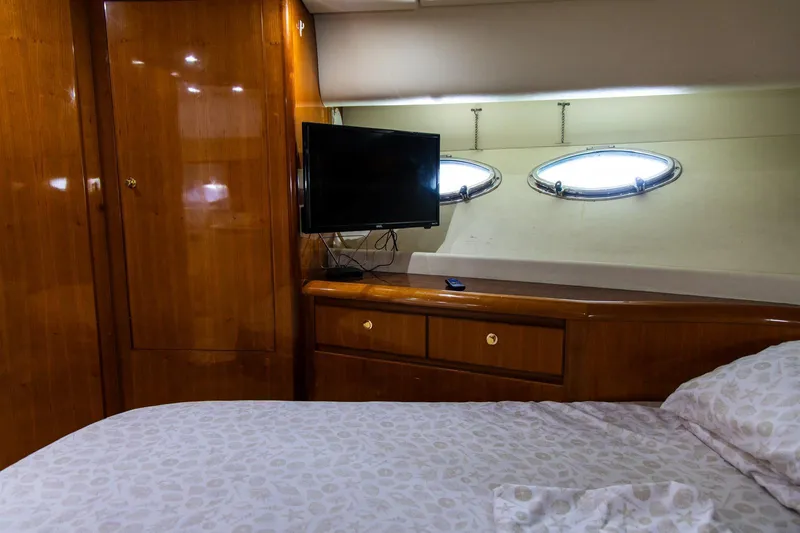 Slide: The Image of Luxurious cabin interior of 2002 Dyna 50 yacht with TV and portholes. - 29