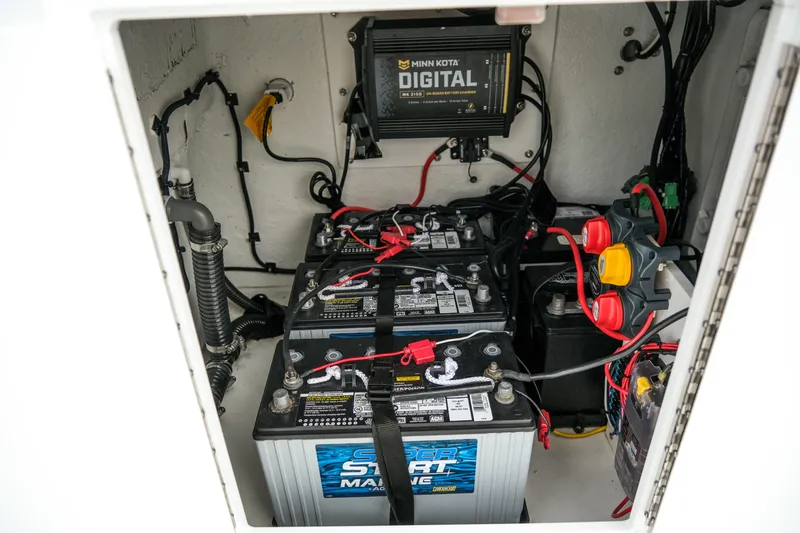 Slide: The Image of Battery compartment of 2022 Banks Panga 24 boat with Minn Kota digital charger. - 13