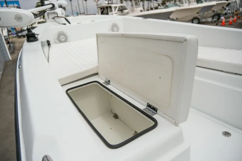 Slide: The Image of Open storage compartment on a 2022 Banks Panga 24 boat, showcasing interior space. - 16