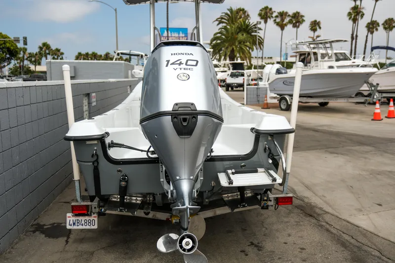 Slide: The Image of 2022 Banks Panga 24 boat with Honda 140 VTEC engine, parked in a marina. - 3