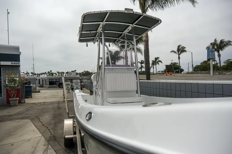 Slide: The Image of 2022 Banks Panga 24 boat at a marina with palm trees in the background. - 8