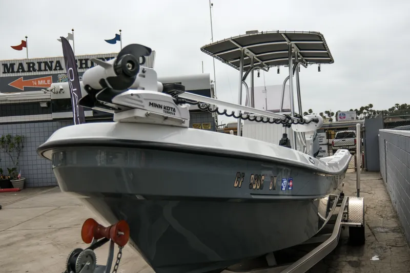 Slide: The Image of 2022 Banks Panga 24 boat with Minn Kota motor at marina entrance. - 9