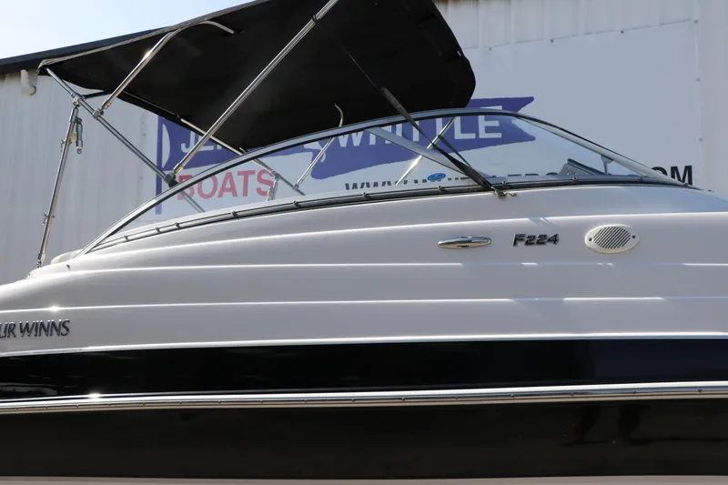 Slide: The Image of 2008 Four Winns 224 Funship boat with canopy, side view. - 11