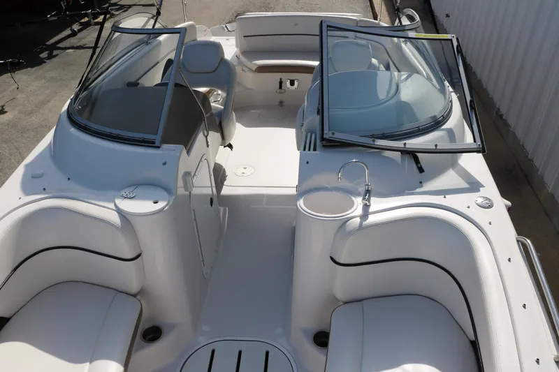 Slide: The Image of 2008 Four Winns 224 Funship boat interior with white seating and windshield. - 16