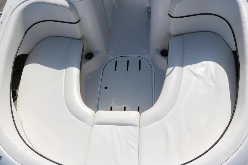 Slide: The Image of 2008 Four Winns 224 Funship boat interior with white cushioned seating. - 19