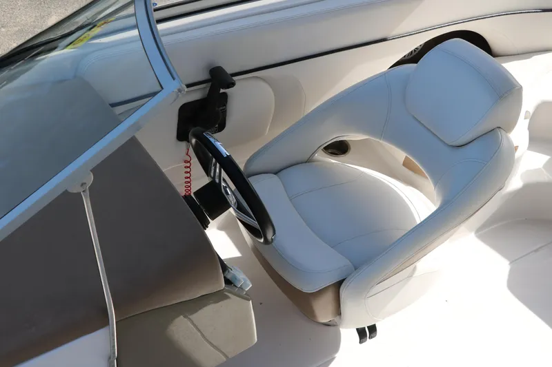 Slide: The Image of Captain's seat and steering wheel of 2008 Four Winns 224 Funship boat. - 21