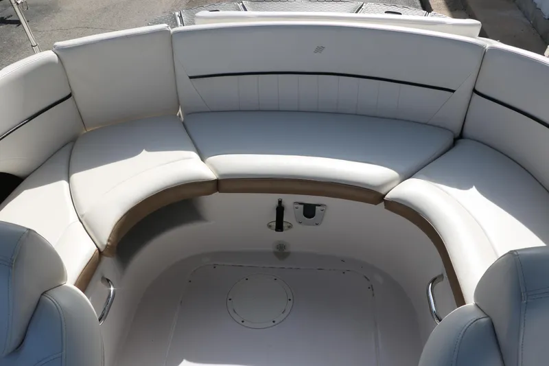 Slide: The Image of 2008 Four Winns 224 Funship boat interior with white cushioned seating. - 26
