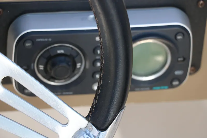 Slide: The Image of Steering wheel and control panel of 2008 Four Winns 224 Funship boat. - 28