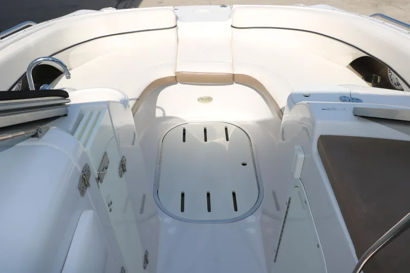 Slide: The Image of 2008 Four Winns 224 Funship boat interior with white seating and storage compartments. - 29