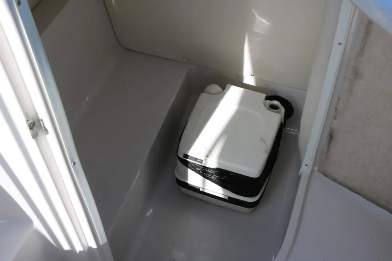 Slide: The Image of Portable toilet in 2008 Four Winns 224 Funship boat compartment. - 31