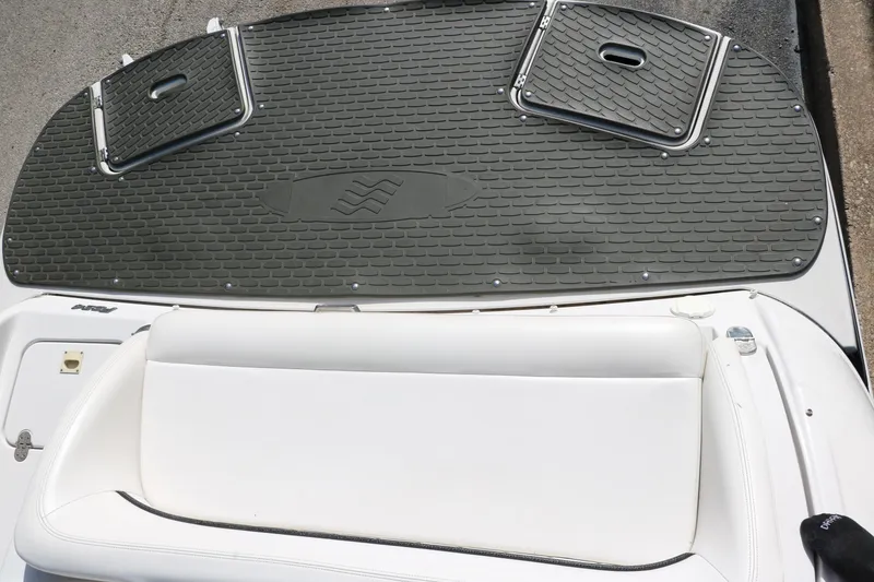 Slide: The Image of 2008 Four Winns 224 Funship boat deck with white seating and textured flooring. - 34