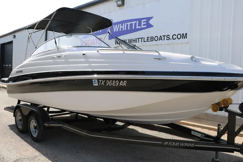 Slide: The Image of 2008 Four Winns 224 Funship boat on trailer, parked outside Whittle Boats dealership. - 4