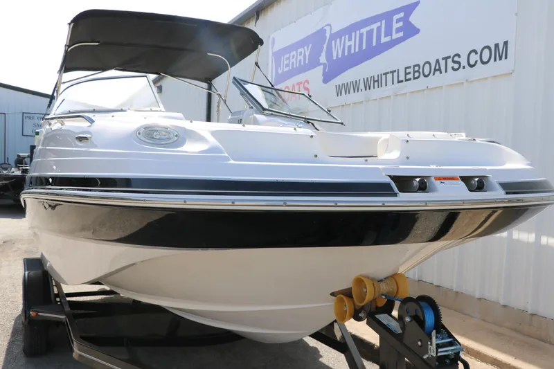 Slide: The Image of 2008 Four Winns 224 Funship boat on trailer at dealership, front view. - 5