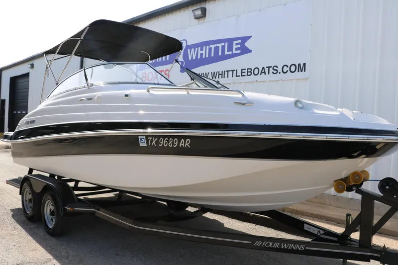 Slide: The Image of 2008 Four Winns 224 Funship boat on trailer, parked outside Whittle Boats dealership. - 7