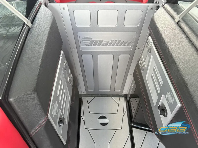 Slide: The Image of Interior of a 2019 Malibu M235 boat, featuring sleek metallic and leather design. - 34