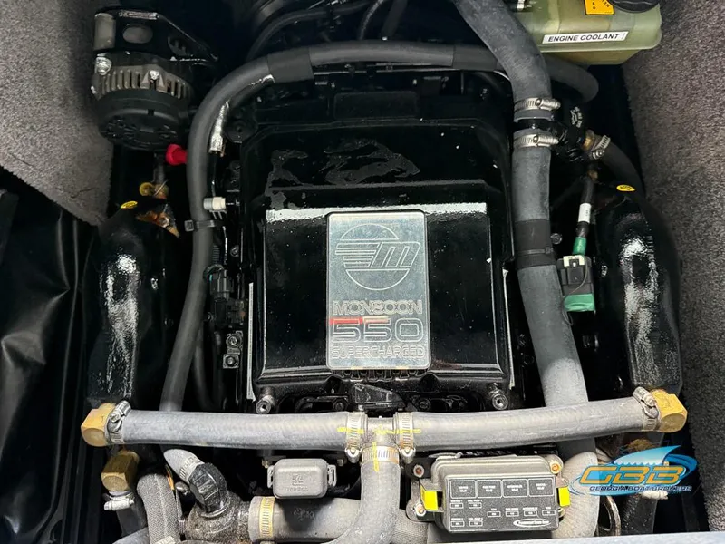 Slide: The Image of 2019 Malibu M235 engine, Monsoon 550 supercharged, with visible hoses and components. - 38