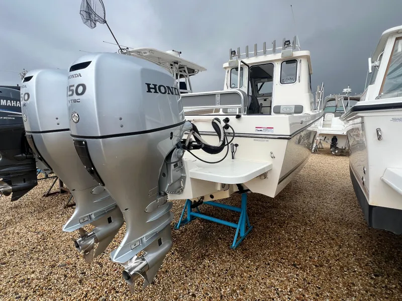 Slide: The Image of 2021 Defiance Admiral 250 EX boat with dual Honda outboard motors on display. - 15