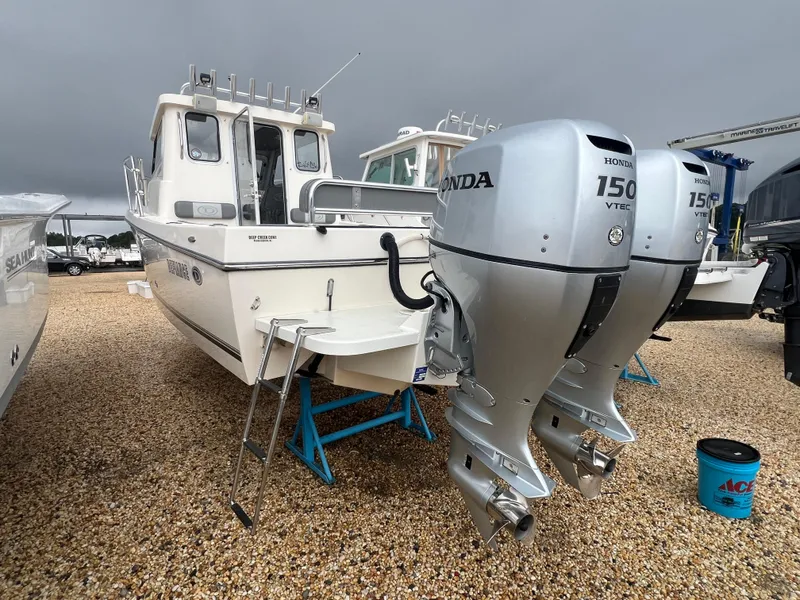 Slide: The Image of 2021 Defiance Admiral 250 EX boat with dual Honda 150 VTEC outboard engines. - 16