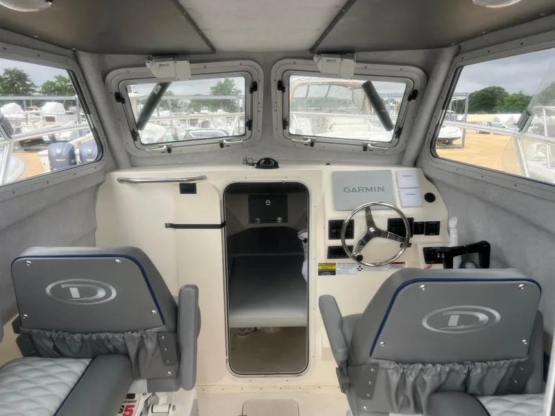 Slide: The Image of Interior of 2021 Defiance Admiral 250 EX boat with Garmin navigation system. - 19