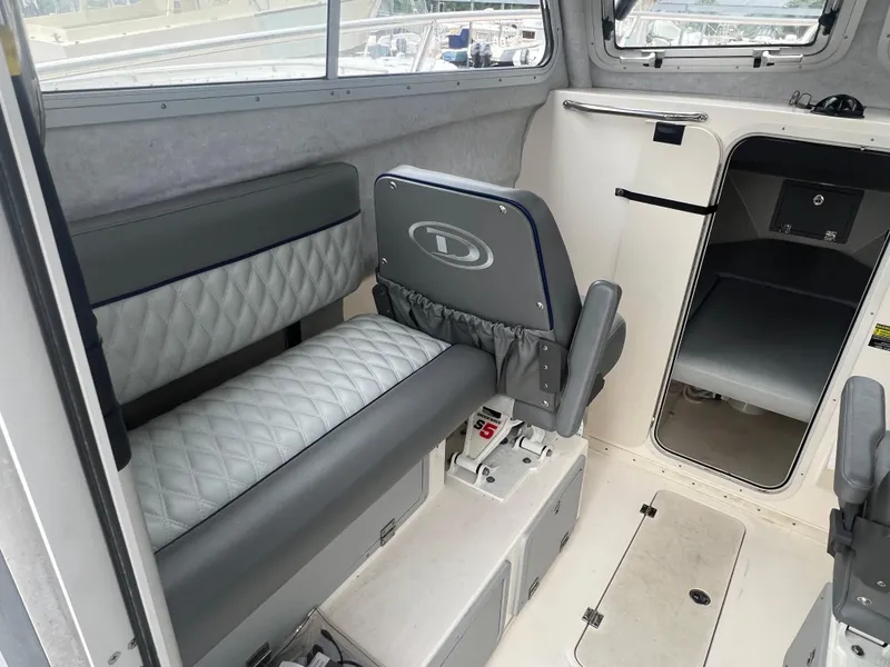 Slide: The Image of 2021 Defiance Admiral 250 EX interior with seating and cabin view. - 30