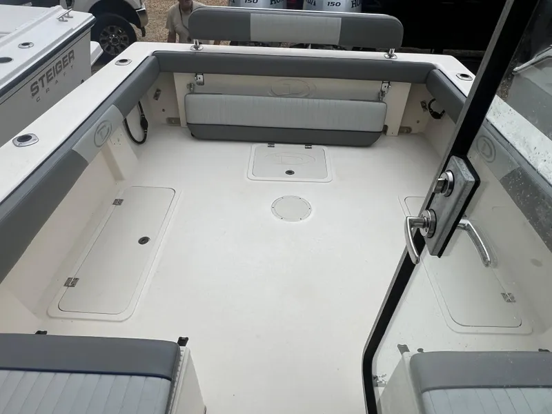 Slide: The Image of 2021 Defiance Admiral 250 EX boat interior with seating and storage compartments. - 32