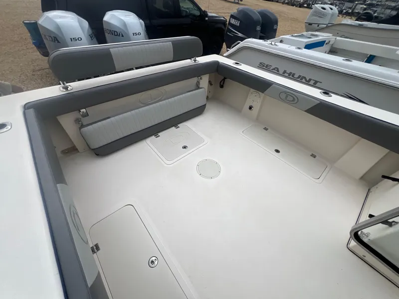 Slide: The Image of 2021 Defiance Admiral 250 EX boat interior with seating and storage compartments. - 36