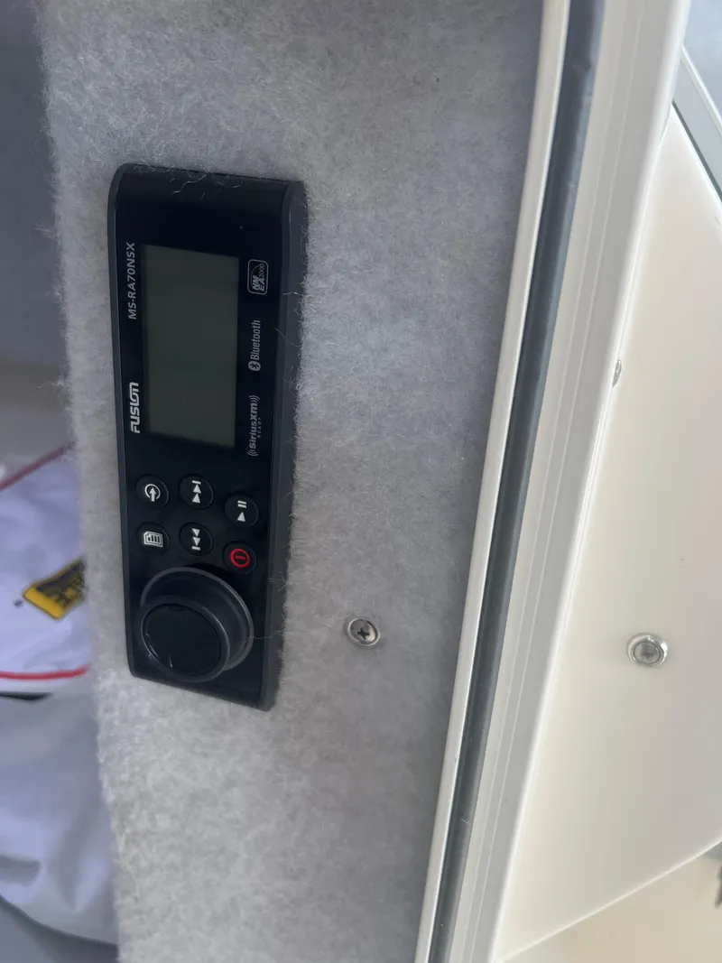 Slide: The Image of 2021 Defiance Admiral 250 EX boat interior with Fusion MS-RA70NSX stereo system. - 42