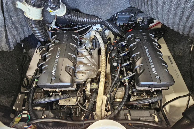 Slide: The Image of 2020 Yamaha Boats SX240 engine compartment with dual high-output engines. - 26