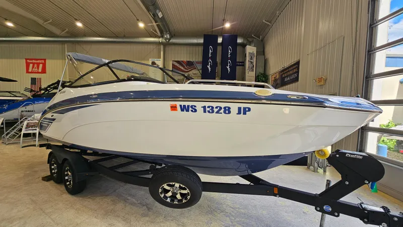 Slide: The Image of 2020 Yamaha Boats SX240 on trailer in showroom, side view. - 3
