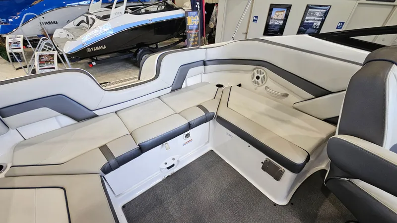 Slide: The Image of Interior of a 2020 Yamaha SX240 boat showcasing seating and speaker system. - 9