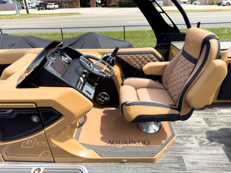 Slide: The Image of Luxurious interior of 2026 Godfrey AquaPatio 23' Flip Lounge Tritoon with elegant seating and table. - 16