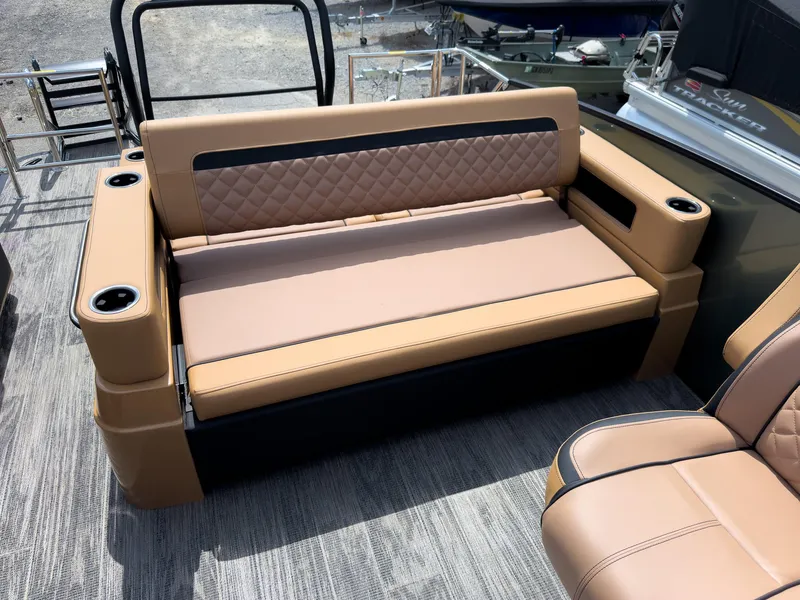 Slide: The Image of 2026 Godfrey AquaPatio 23' Flip Lounge Tritoon interior with luxurious seating and ambient lighting. - 28