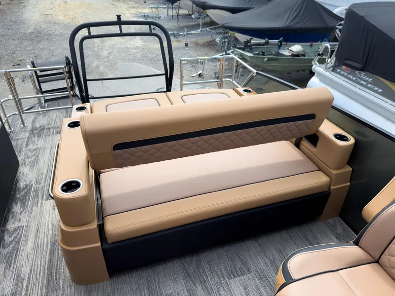 Slide: The Image of 2026 Godfrey AquaPatio 23' Flip Lounge Tritoon interior at a boat show. - 29